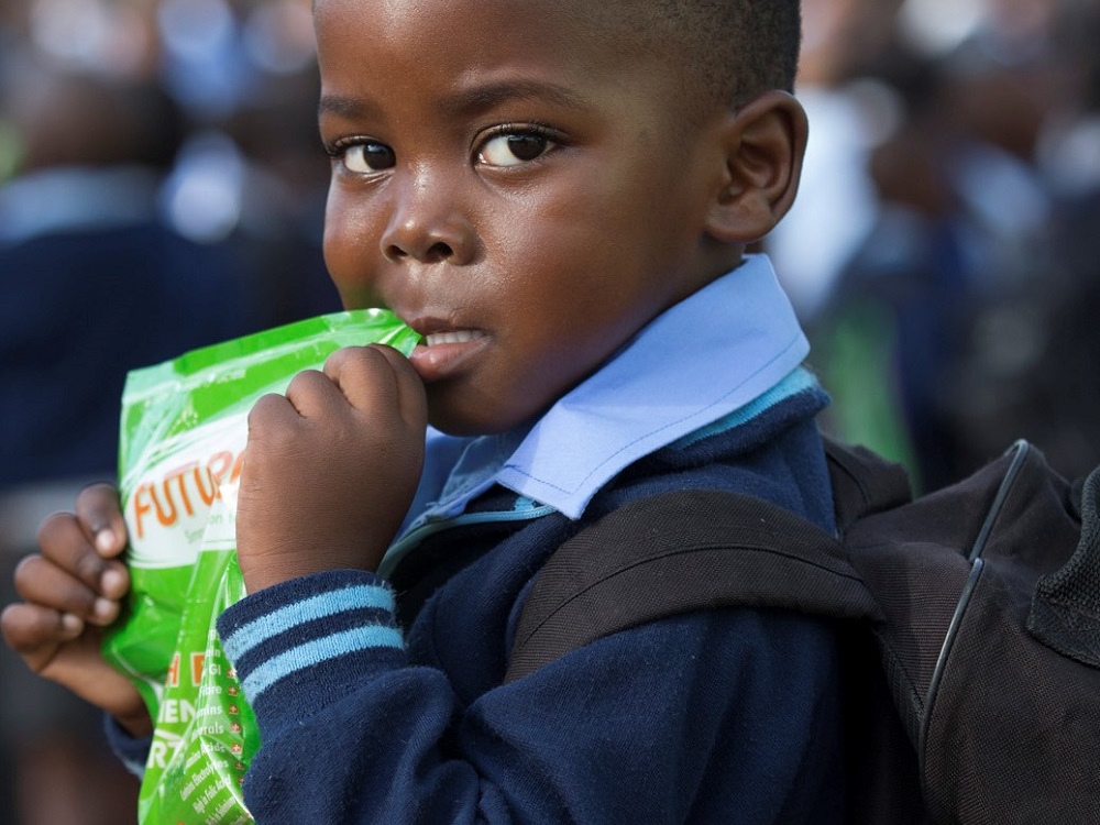 Child with Futurelife pouch cropped.jpg