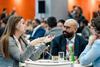 Three Sustainable Packaging Summit delegates sat talking around a table