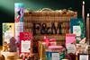 A Fortnum & Mason Hamper in the background, with various edible products in the foreground