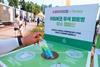 A hand extends from off-camera, holding a bottle labelled 'I'm Eco'. It is being held over a recycling bin, on which is written 'Incheon Pentaport Rock Festival 2022 x I'm Eco'.
