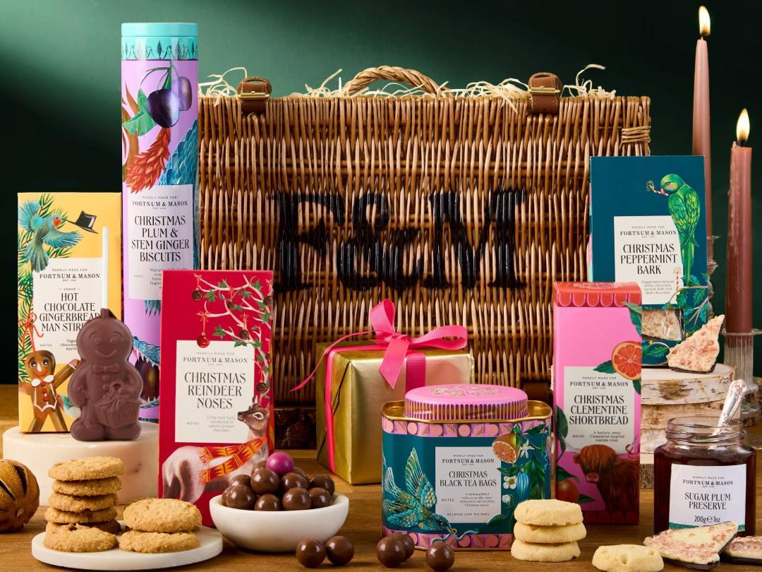 A Fortnum & Mason Hamper in the background, with various edible products in the foreground
