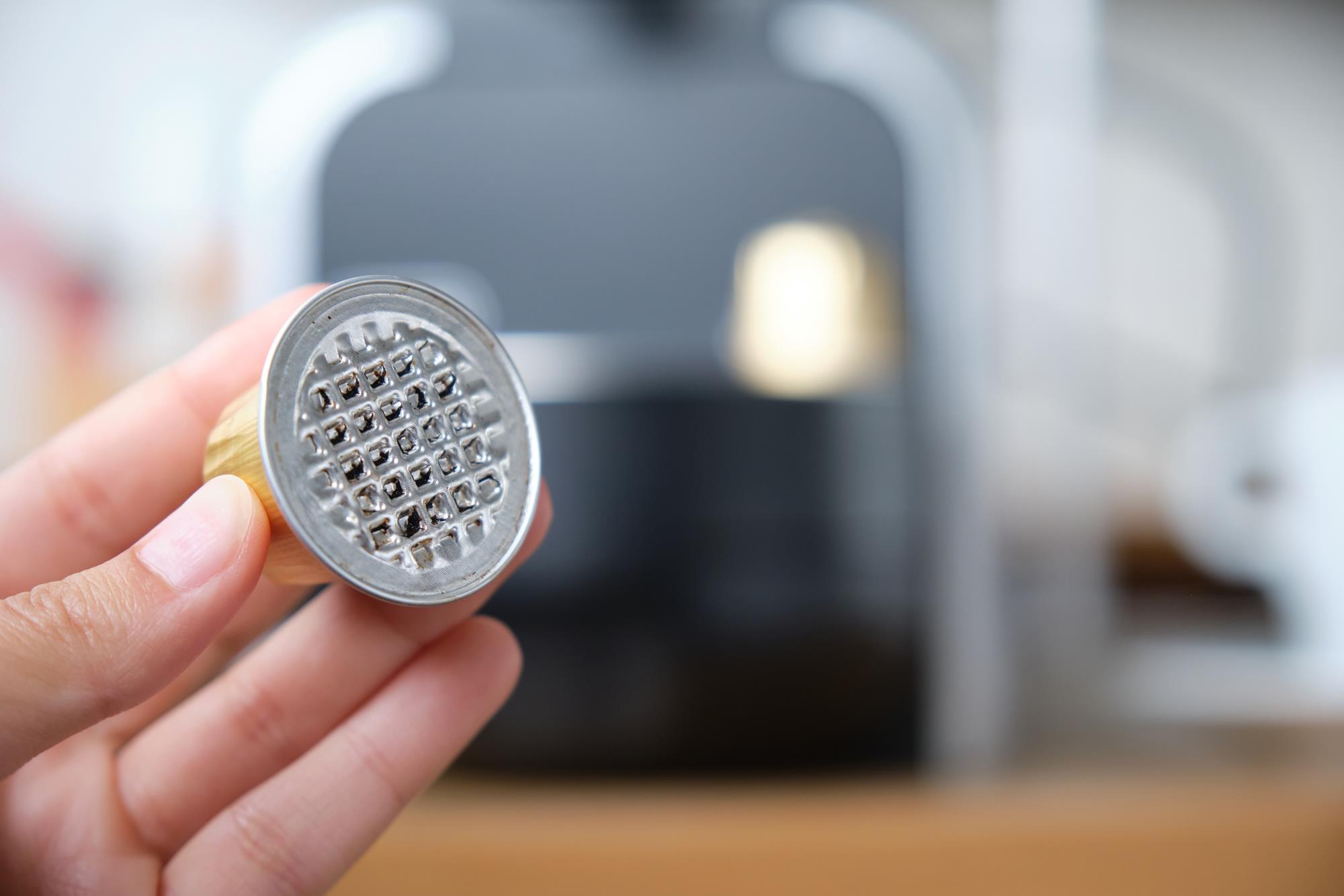 ACTEGA coffee capsule in hand
