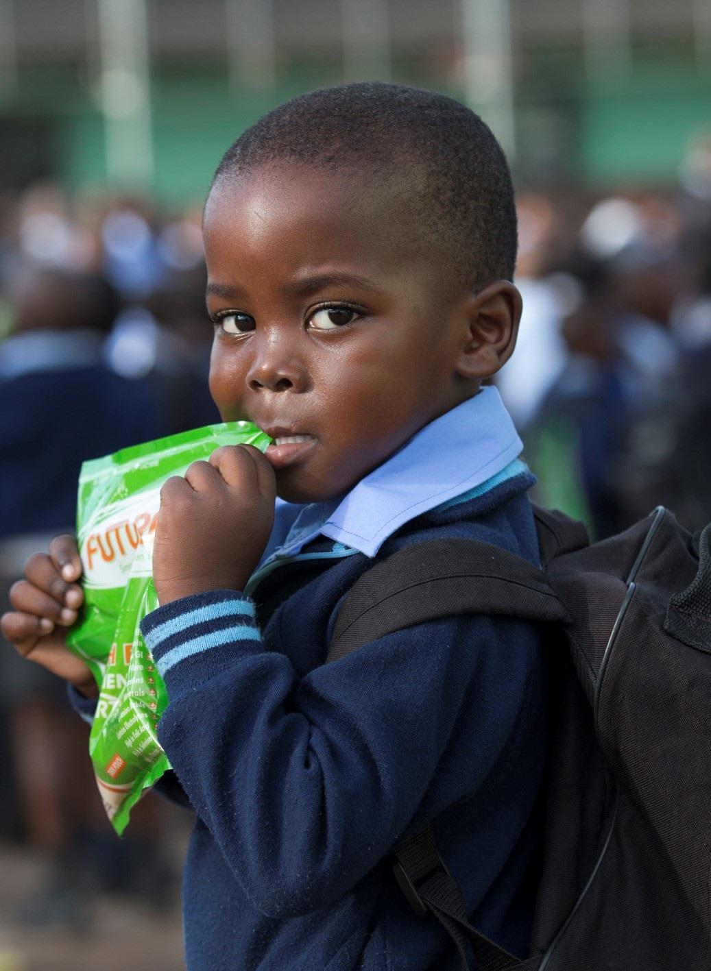 Child with Futurelife pouch.jpg