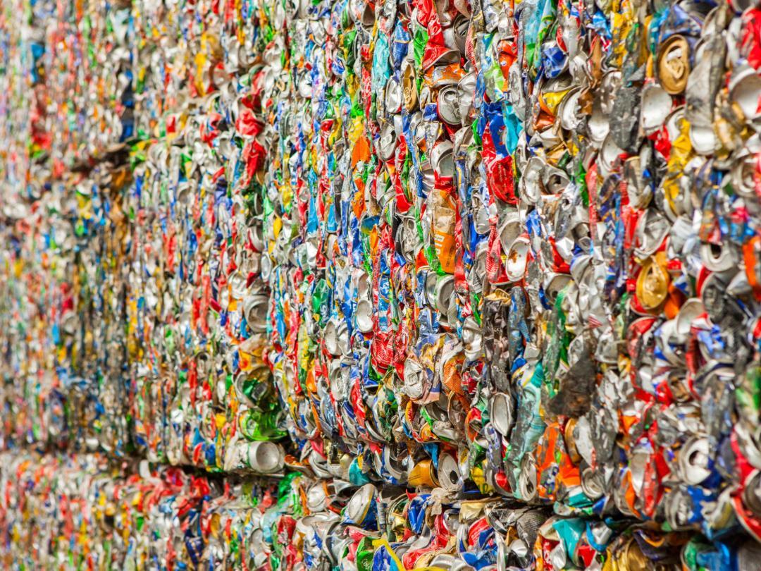 Crushed aluminium cans collected into cubes