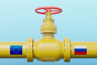 A yellow gas pipeline meets at a valve in the middle. On the left pipe is the EU flag, on the right is the Russian flag.