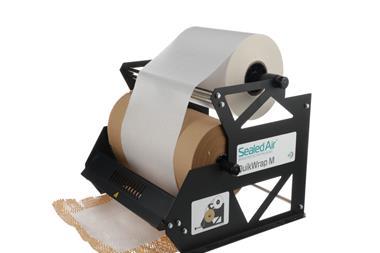 A photograph of Sealed Air's QuikWrap M paper dispenser. It is a metal structure holding two rolls of honeycomb and tissue paper, respectively. It provides a sharp edge on which the paper can be unrolled and ripped to the required length.