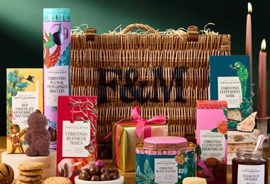 A Fortnum & Mason Hamper in the background, with various edible products in the foreground