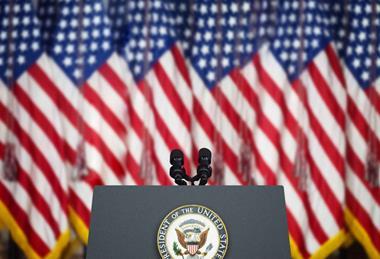 Empty Tribune for Speeches American President Against the American Flags Background.