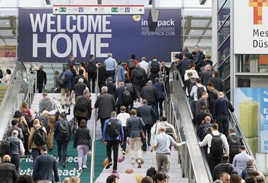 A picture from interpack, with people milling around in an event hall
