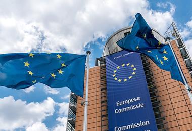 EU flag flying in front of the EU Commission building in Brussels