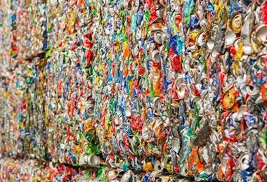 Crushed aluminium cans collected into cubes
