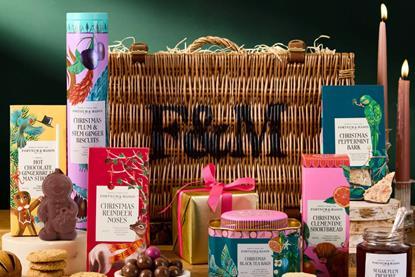 A Fortnum & Mason Hamper in the background, with various edible products in the foreground