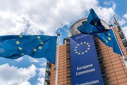 EU flag flying in front of the EU Commission building in Brussels