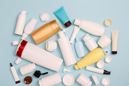 A range of different kinds of plastic HDPE bottles set against a light blue background