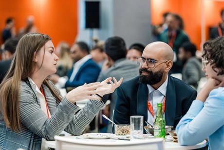 Three Sustainable Packaging Summit delegates sat talking around a table