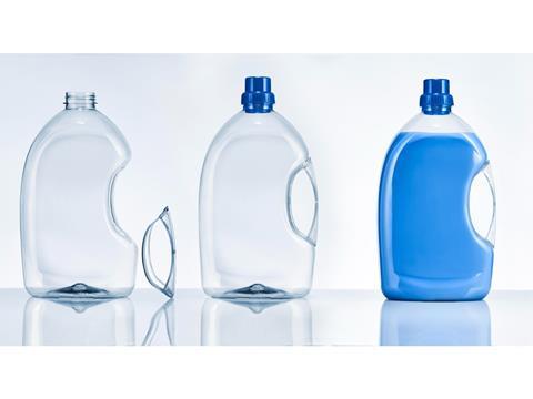 Three PET plastic bottles are lined up in a row. The left and middle are empty, although the latter's handle and lid have been separated from the bottle. The bottle on the right is lidded, the handle is attached, and it is filled with blue liquid.