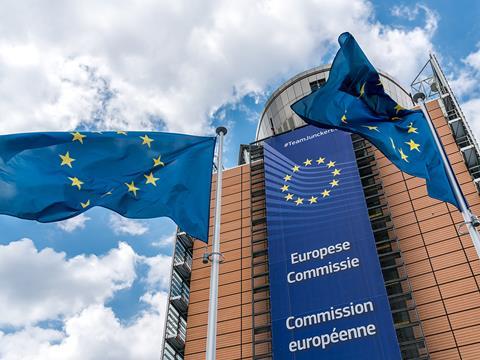 EU flag flying in front of the EU Commission building in Brussels